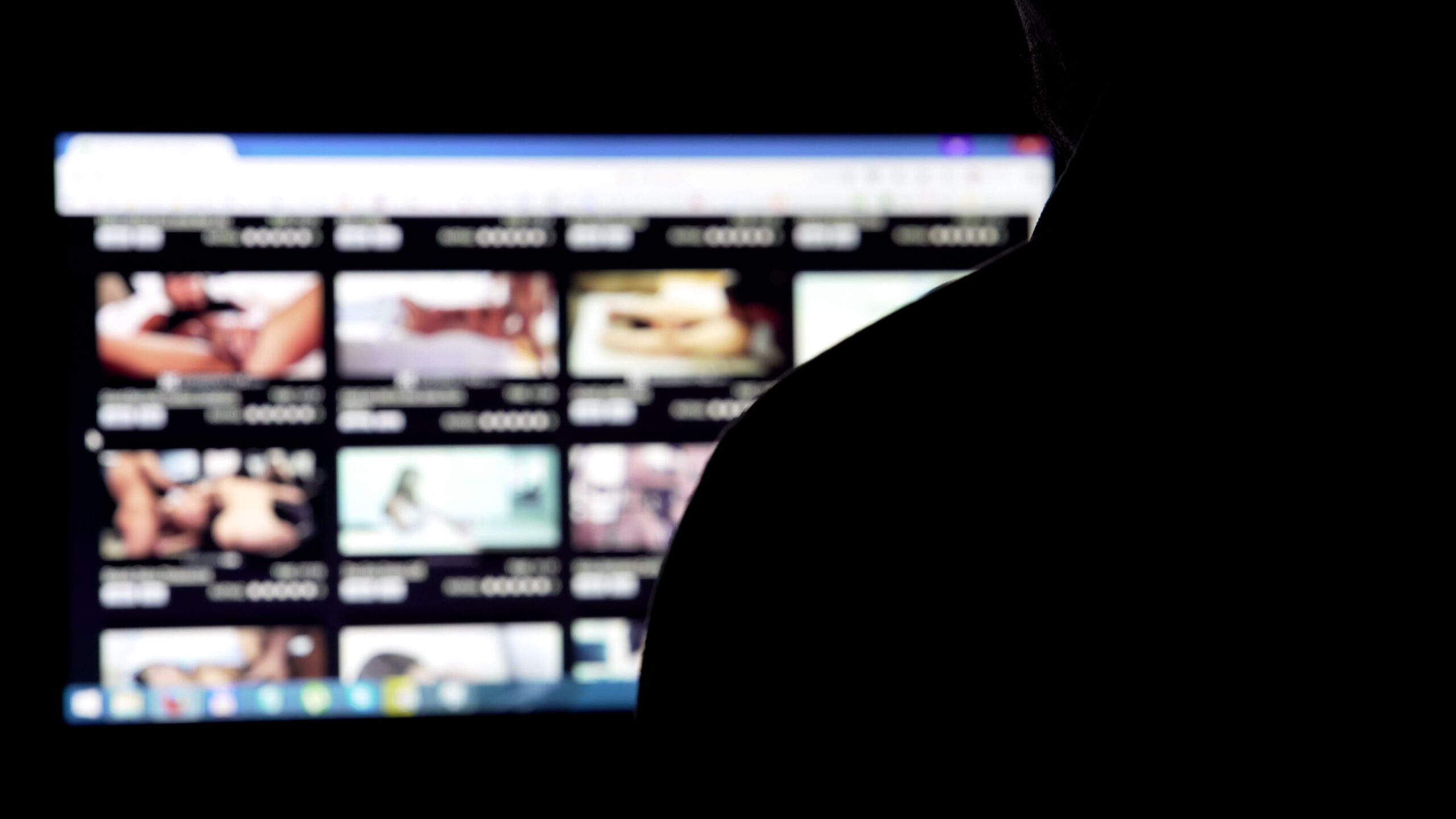 Man silhouette choosing adult videos in internet, parental contr
